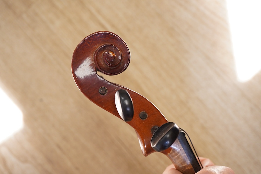 A cased students violin